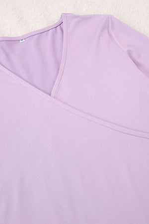 Draped wrap top in light purple with V-neck and subtle stitching detail.