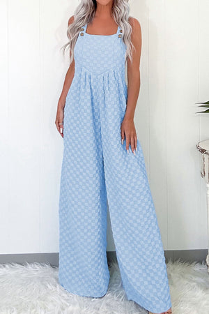 Light blue checkered button-strap palazzo jumpsuit with a square neckline and wide legs.