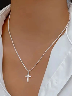 Sparkling cross pendant necklace in silver sterling silver with a delicate chain.