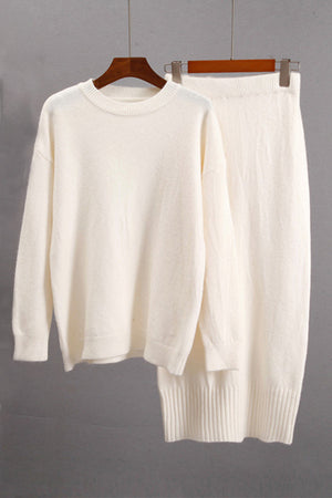 Cream ribbed knit midi co-ord set with crew neck sweater and midi skirt.