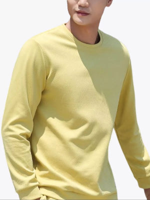Men's pastel yellow crew neck long sleeve sweatshirt with ribbed texture