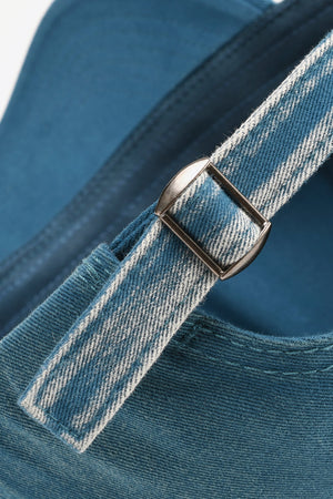 Baseball cap in Navy denim with adjustable strap and metal buckle detail.