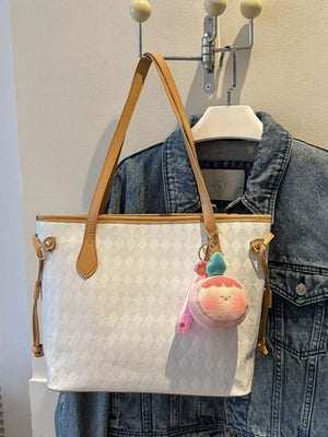 Textured diamond woven tote bag in white with tan straps and a cute peach charm.
