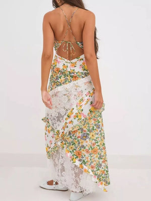 Maxi dress with floral print, lace trim, and crisscross back detail.