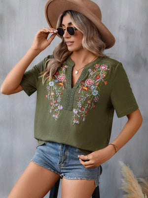 Army green v-neck tee with colorful floral embroidery and crochet trim detail
