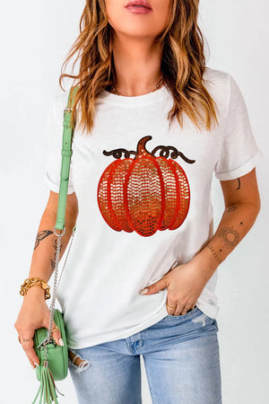 White t-shirt with sequin pumpkin appliqué and short sleeves.