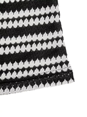 Black and white striped knit maxi dress with a textured pattern.