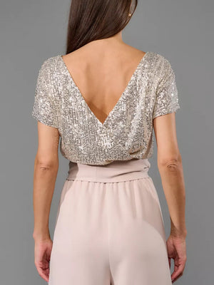 Sequin bodice with V-neck and palazzo pants in dusty pink.