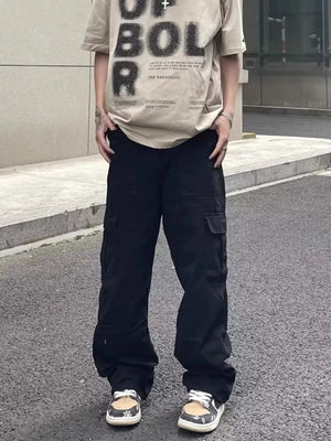 Men's black relaxed fit cotton cargo pants with multiple pockets.