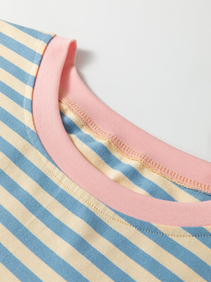 Striped round-neck t-shirt in light blue and cream with a pink neckline detail.