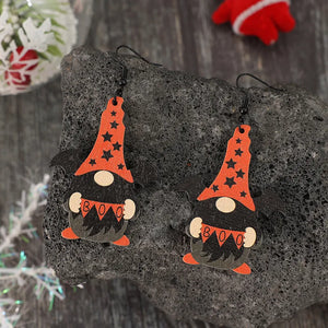Black Halloween gnome wood drop earrings with bat wings and orange star hats.