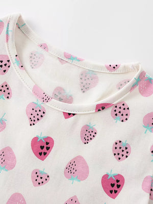 Toddler cotton dress with pink strawberry print and ruffled details.