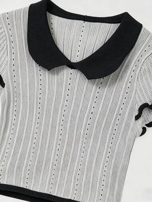 Gray knit maternity t-shirt with black Peter Pan collar and ruffled sleeves.