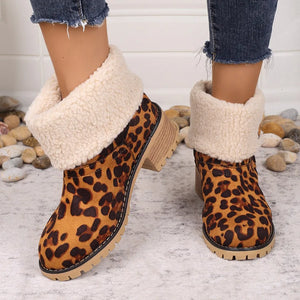 Red leopard print sherpa cuff booties with chunky heel and lug sole.
