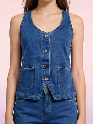 Button-down denim halter vest in dark blue with two front pockets and a V-neckline.