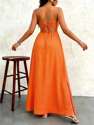 Orange maxi dress with cutout back, tie detail, and thigh slit.
