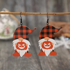 Gnome plaid pumpkin patch earrings with orange hats and white beards.