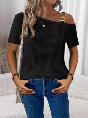 Black waffle knit one-shoulder t-shirt with gold chain detail on strap.