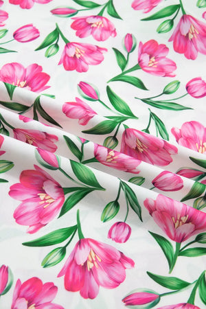Tulip print polyester blouse with ruffled V-neck and frills.