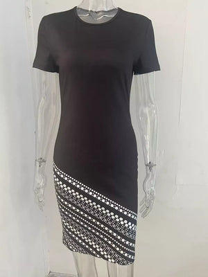 Black bodycon mini dress with geometric print detail on the hem