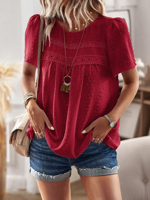 Deep Red textured puff sleeve blouse with lace yoke detail and short sleeves.
