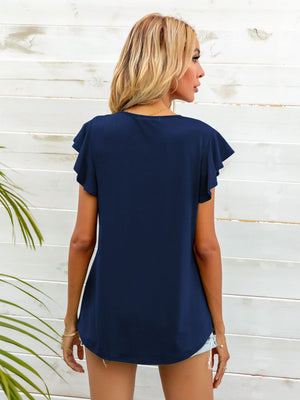 Navy tee with ruffled short sleeves and A-line cut.