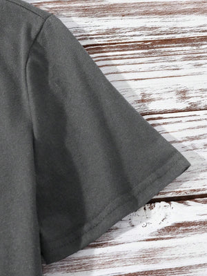 Dark gray short sleeve t-shirt with a shamrock graphic detail.