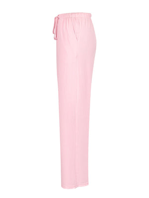 Pink crinkled wide leg pants with drawstring waist and pockets