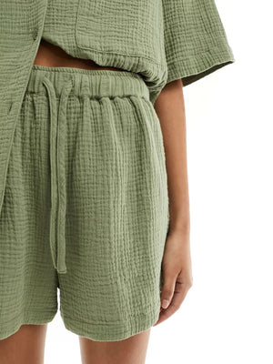 Army green crinkle cotton pajama shorts with drawstring waist and matching short-sleeve top.