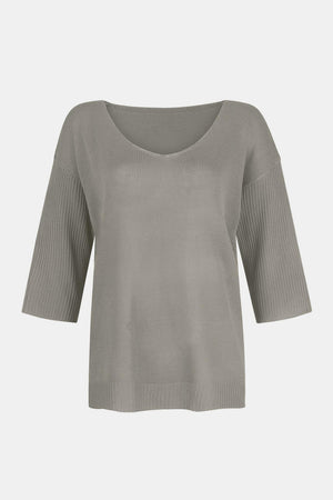 Gray knit sweater with V-neck and flared 3/4 sleeves.
