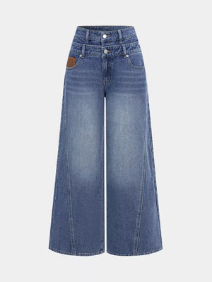 Chic high-waisted wide-leg jeans in blue denim with button closure and a brown leather patch detail.