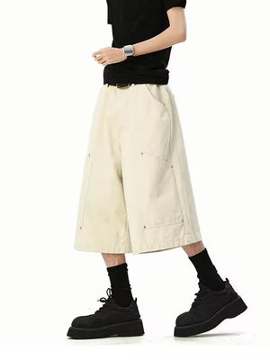 Relaxed fit apricot cargo shorts with utility pockets and below-knee length.