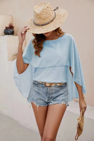 Light blue dotted swiss blouse with cape sleeves and a tiered overlay.