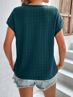 Dark green woven cap-sleeve top with textured fabric and a relaxed fit.
