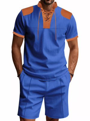 Men's sapphire blue two-piece set with lace-up detail and tan accents.
