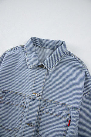 Light pinstripe denim trucker jacket with button front and chest pockets.