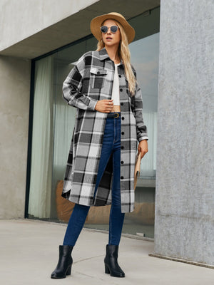 Oversized plaid shirt jacket dress in black and white, featuring button front and pockets.