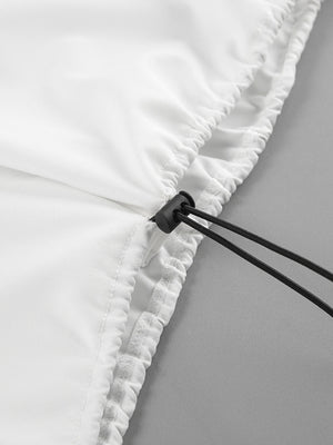 White two-piece set detail with drawstring and snap closure