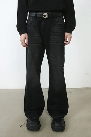 Black faded flare denim jeans with a wide leg and distressed details.