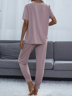 Lilac relaxed-fit tee and jogger lounge set with short sleeves and cuffed ankles.