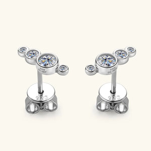 Silver ear climbers with five clear cubic zirconia stones in a celestial cluster design.