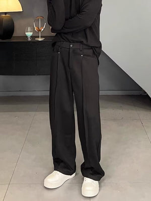 Men's black relaxed fit wide leg sweatpants with front seam detail.