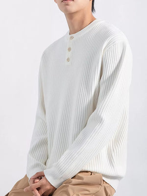 Men's white ribbed knit long sleeve top with button detail neckline