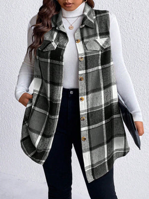 Oversized plaid shirt vest with button front and chest pockets, styled over a turtleneck.