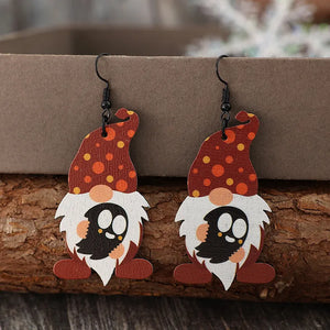 Spotted gnome wood dangle earrings in deep red with orange and yellow dots.