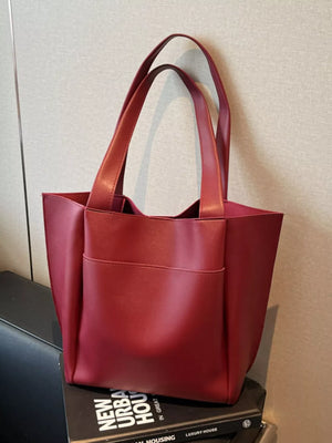 Wine red pu leather tote bag with front pocket and double handles.