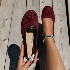 Burgundy breathable knit ballet flats with a round toe and cushioned insole.