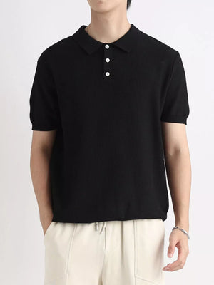 Black ribbed short sleeve polo shirt with classic collar and three white buttons.