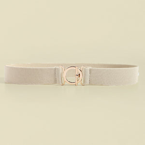 Elasticated belt in ivory with a rose gold circle buckle and toggle closure.