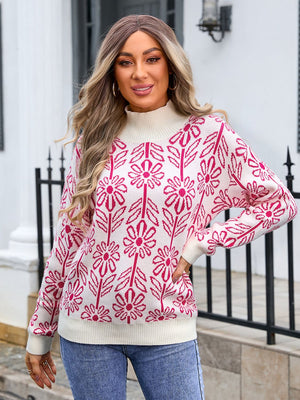 Geometric floral knit turtleneck pullover in cream with pink flowers and leaves pattern.